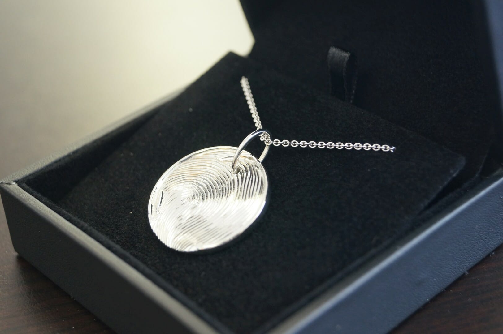 Picture of Custom Pendant in 19K White Gold with Hand Engraved Fingerprint and Accent Diamond